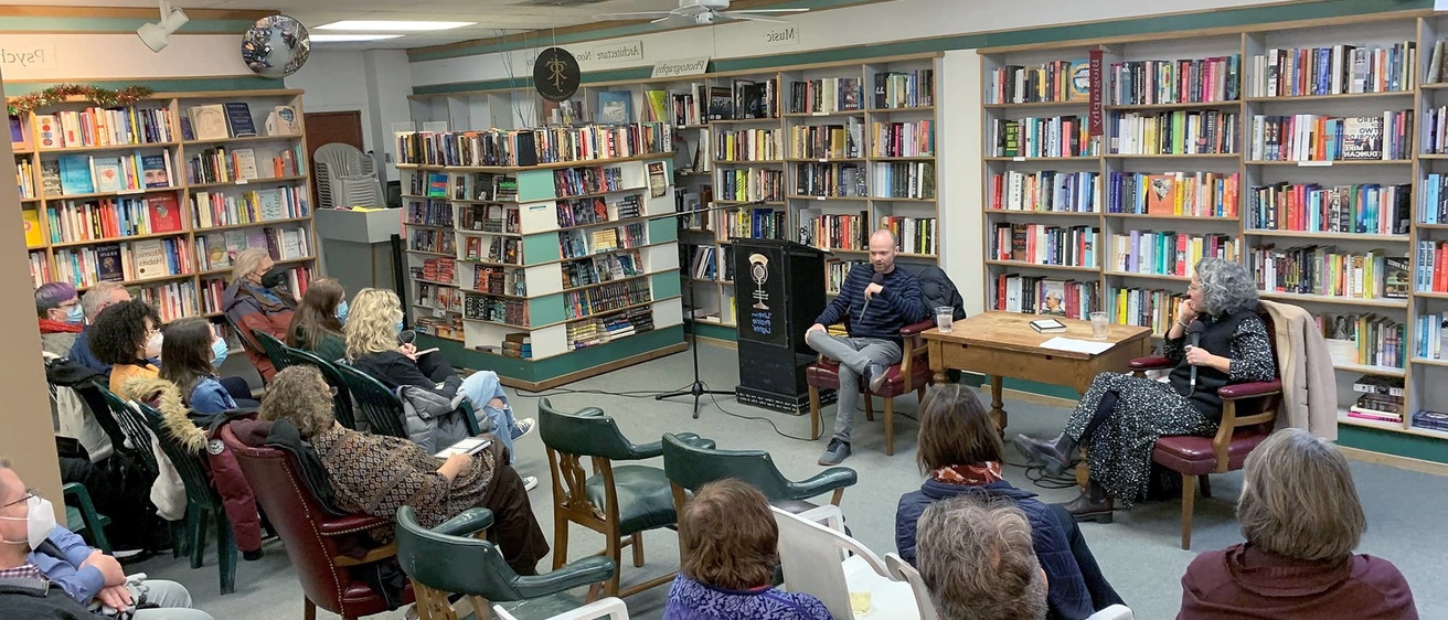 people gathered at a book reading event