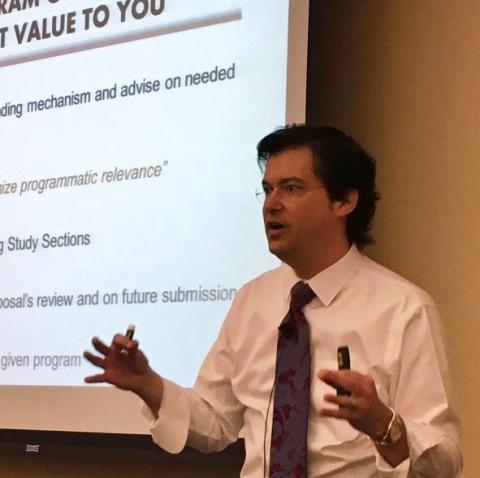 Dr. John Robertson presenting at a past workshop