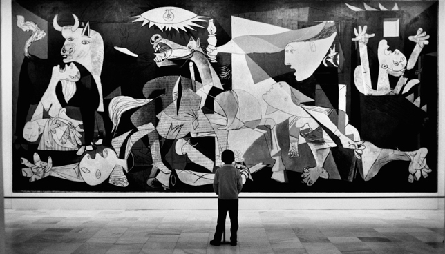 Child looking at Guernica painting