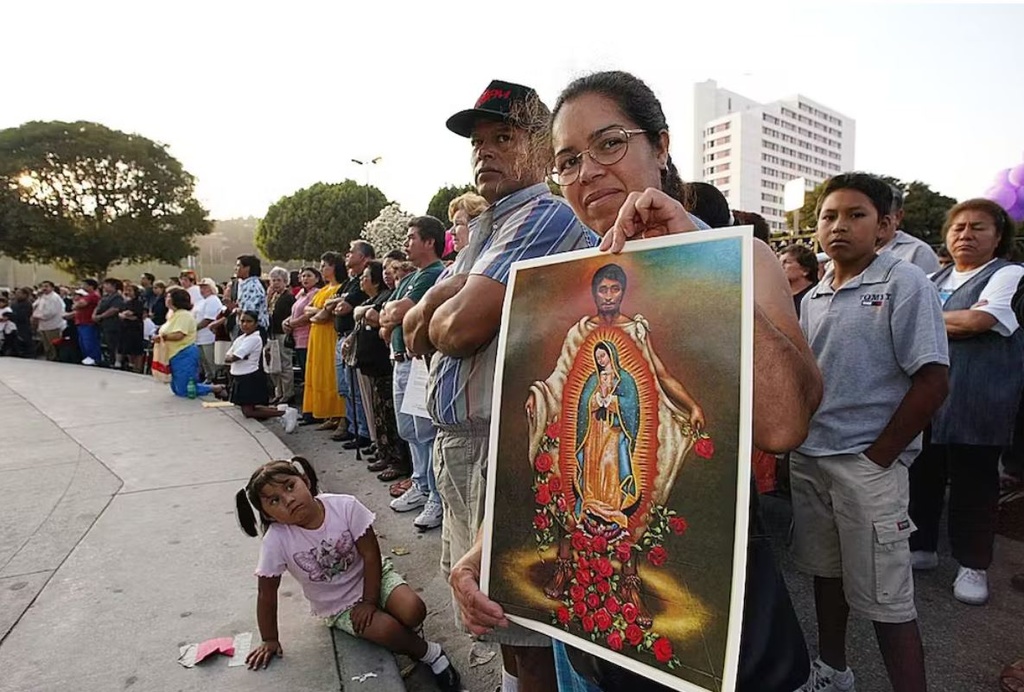 woman with poster of Juan Diego