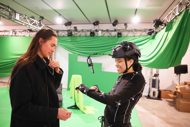 Kaelen Novak, left, works with an actor in the Department of Theatre's motion capture lab.