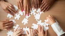 hands on puzzle pieces