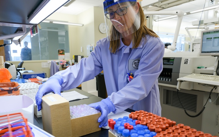 Staff member works in State Hygienic Lab during COVID State Hygienic Lab COVID work