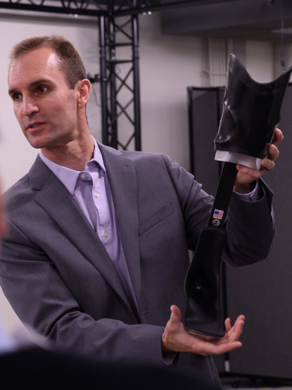 Jason Wilken holds custom orthotic Jason Wilken