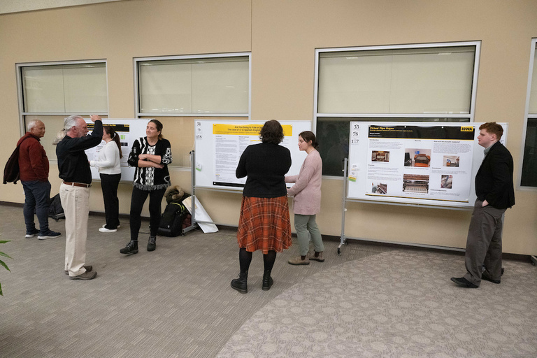 Attendees view posters during SURF