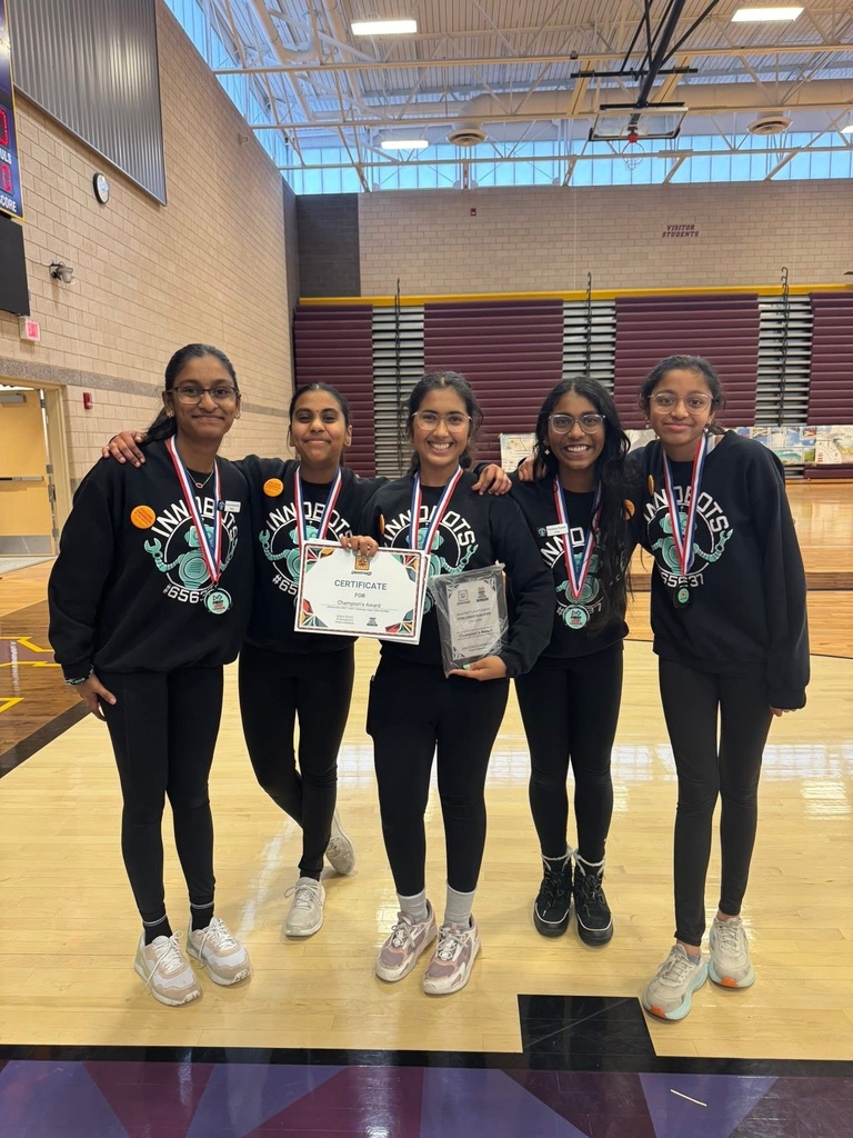 all female robotics team poses with their winning medals