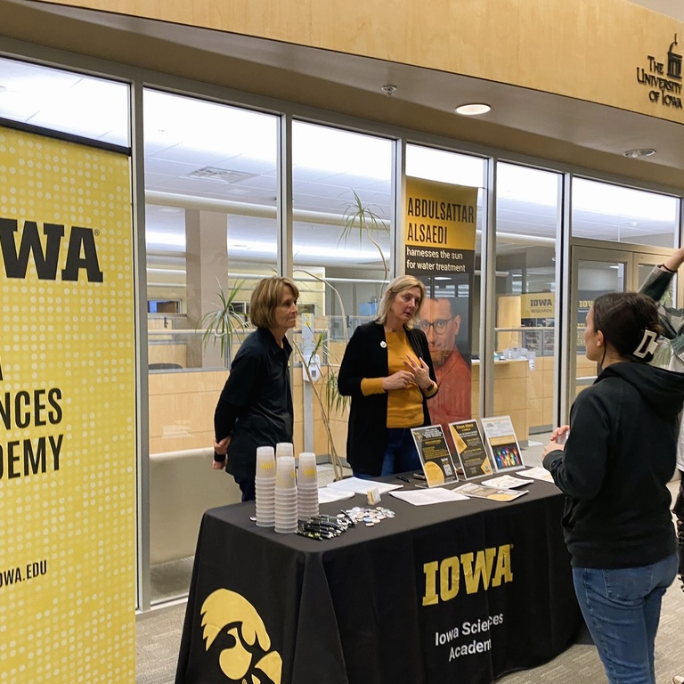 Iowa Sciences Academy Staff meeting with fair guests