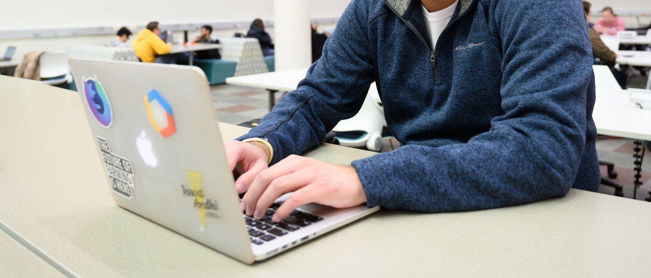 UI student working on a computer