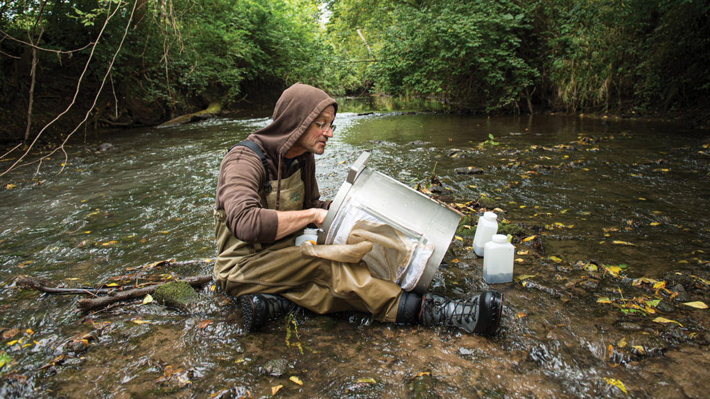 SHL limnologist Todd Hubbard in river SHL limnologist Todd Hubbard in river