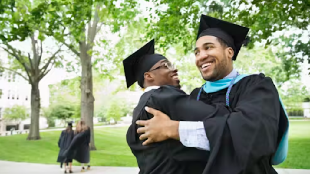 Two graduates embracing